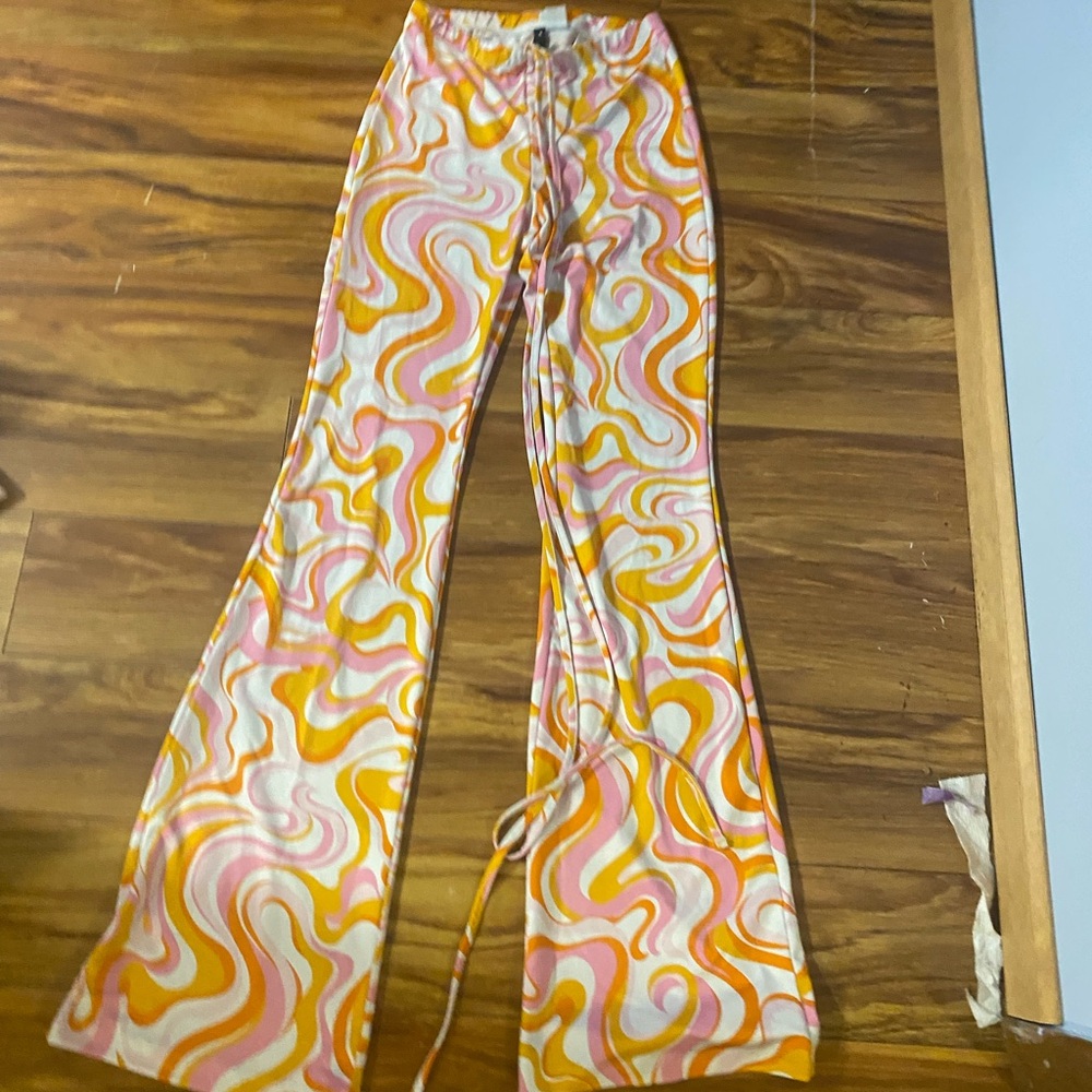 Super cute retro flare pants with ties that go up the waist! Only worn one time!